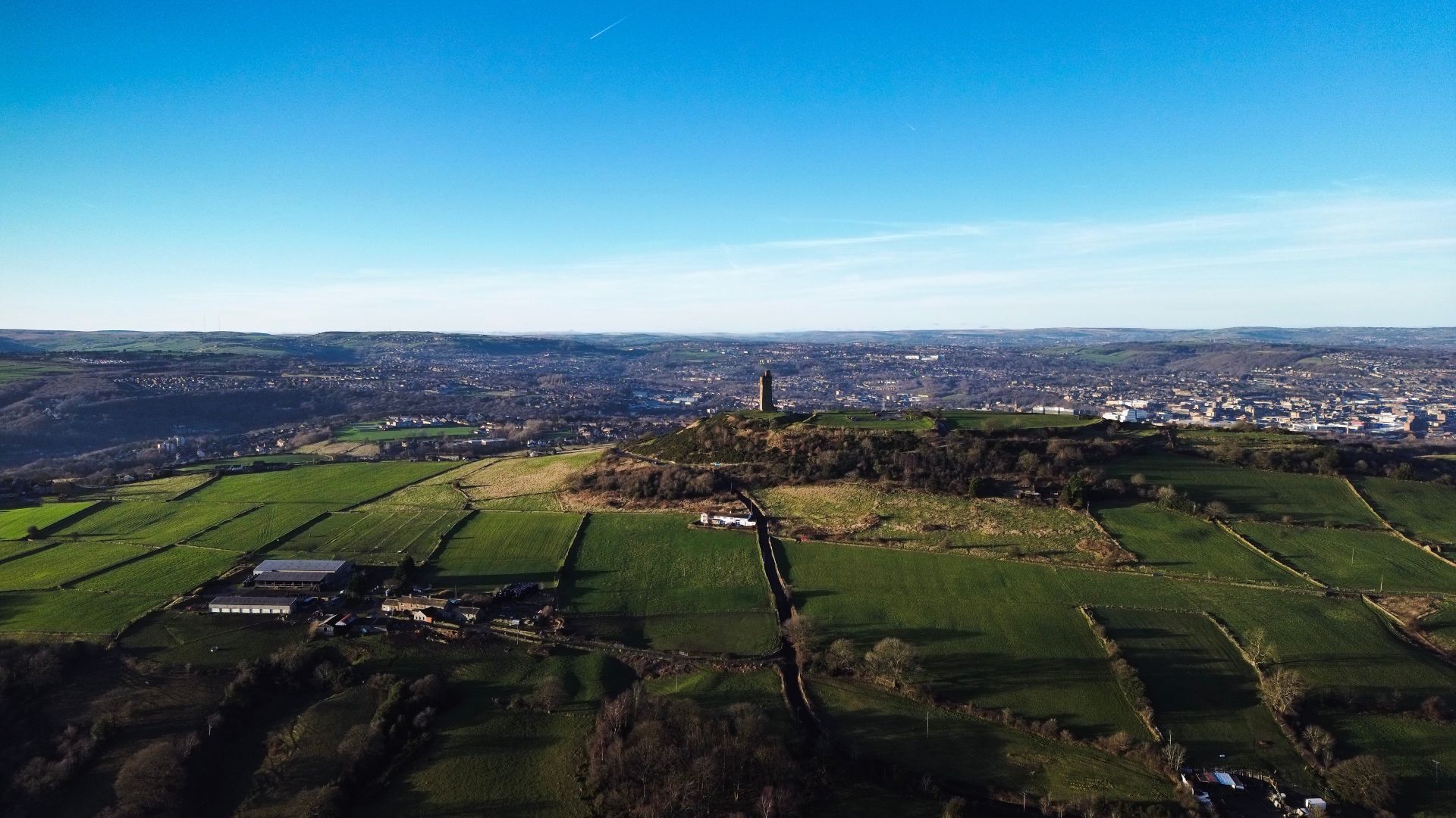Aerial drone photograph of Castle Hill and Victoria Tower above Huddersfield, West Yorkshire