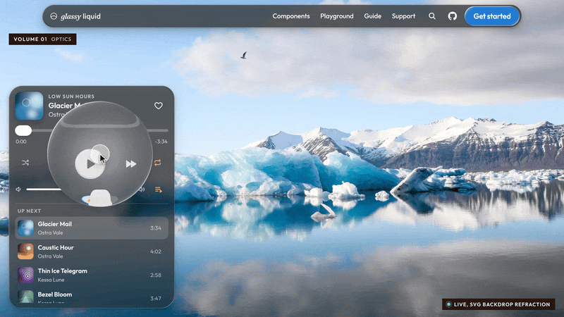 A round glass lens loops over a glass music player and a glacier photo, bending the player controls and the ice beneath it