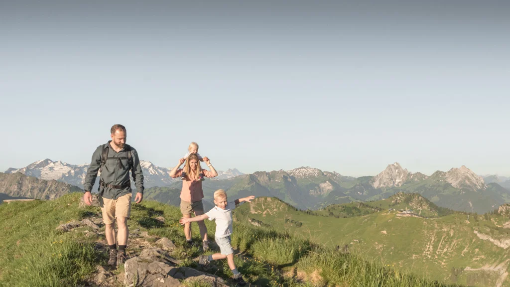Hikers on a rocky outcrop in the Swiss Alps