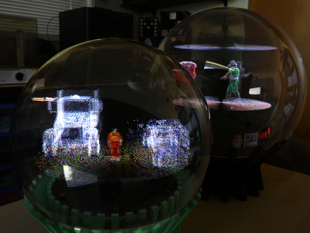 Two orbs — one running Doom, one GTA
