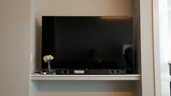 Image of tv/sound bar turning on and a youtube stream loading