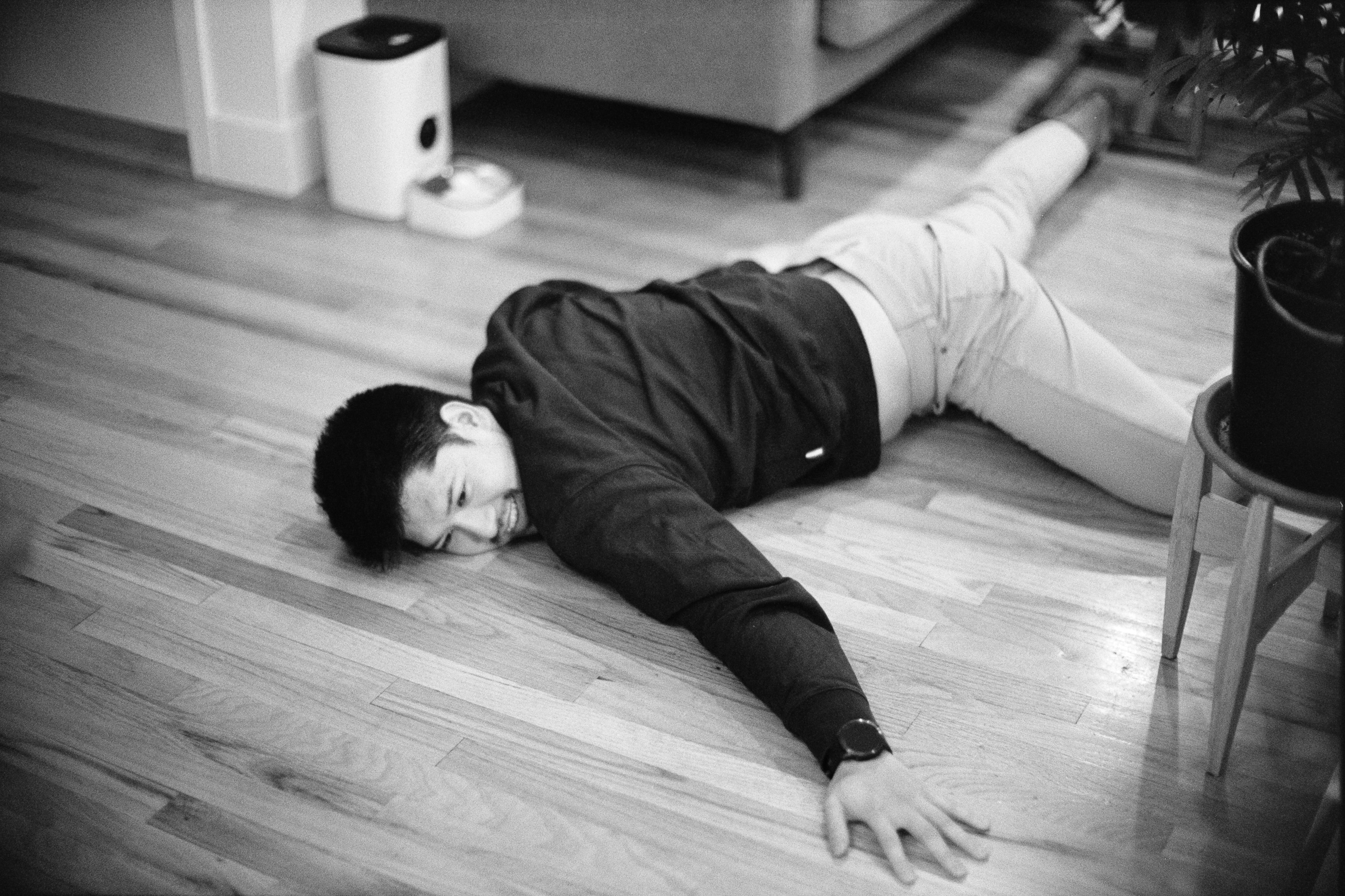 J lying on the floor