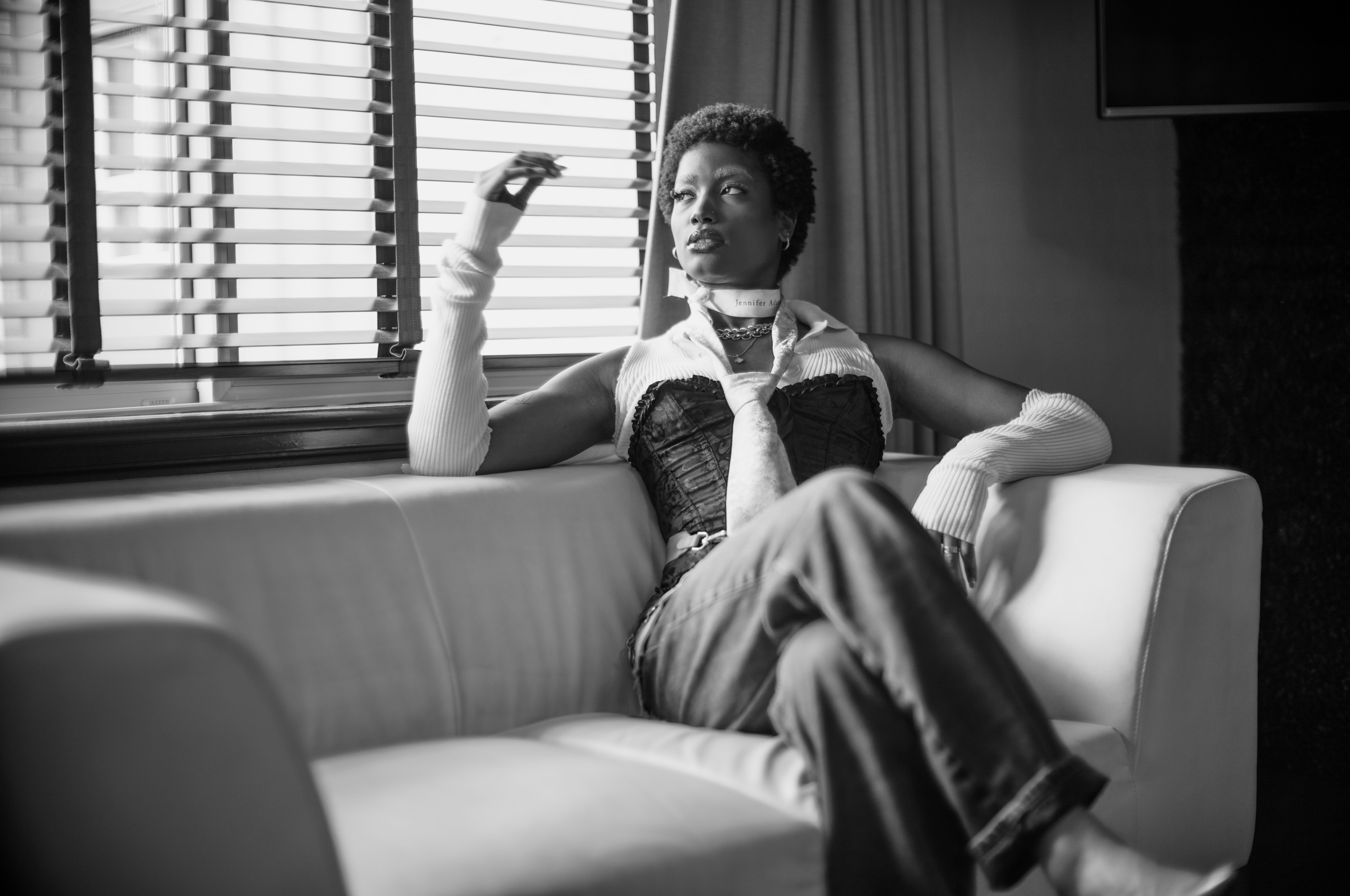 Model sitting on sofa