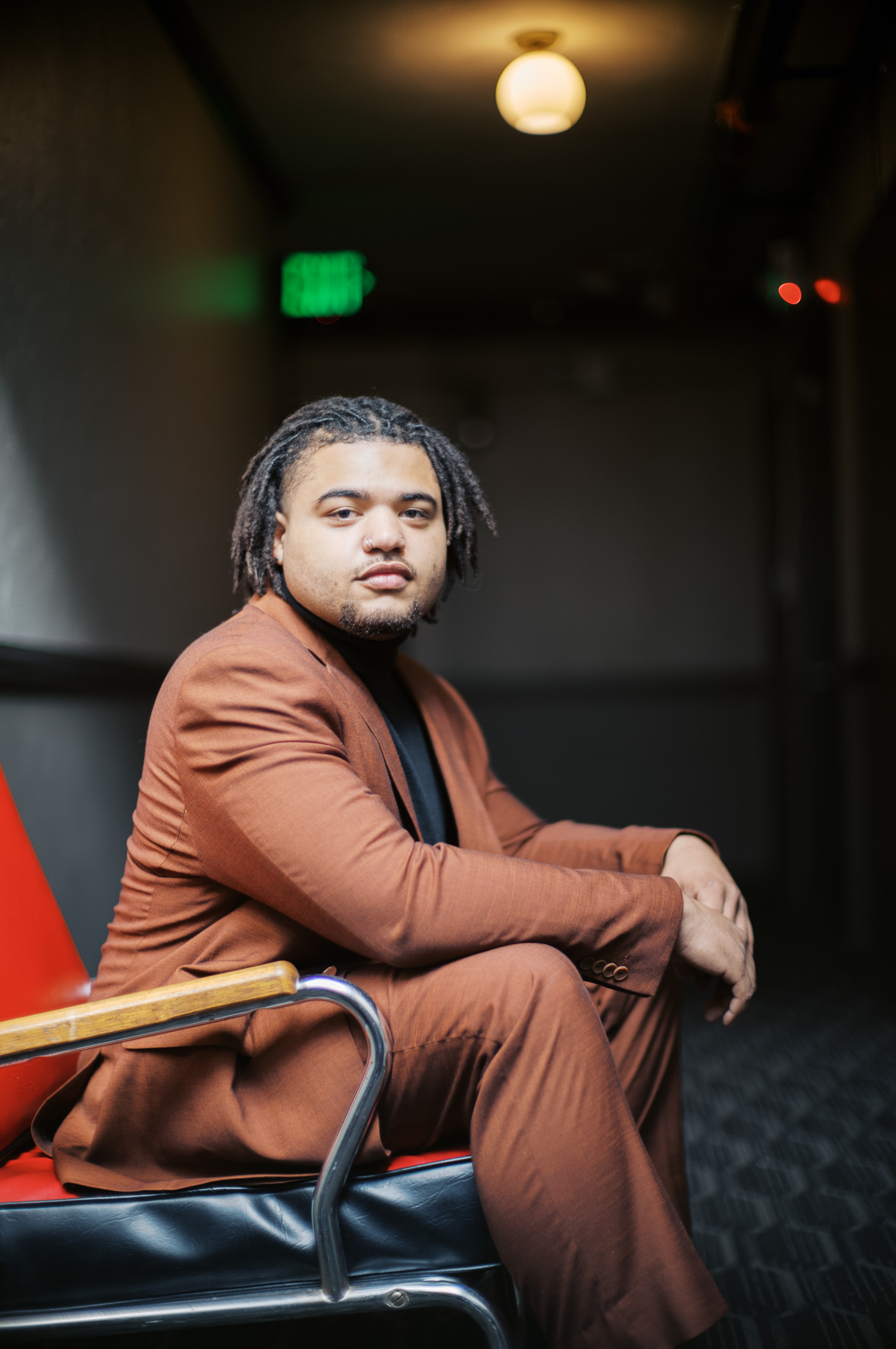 Model sitting on chair