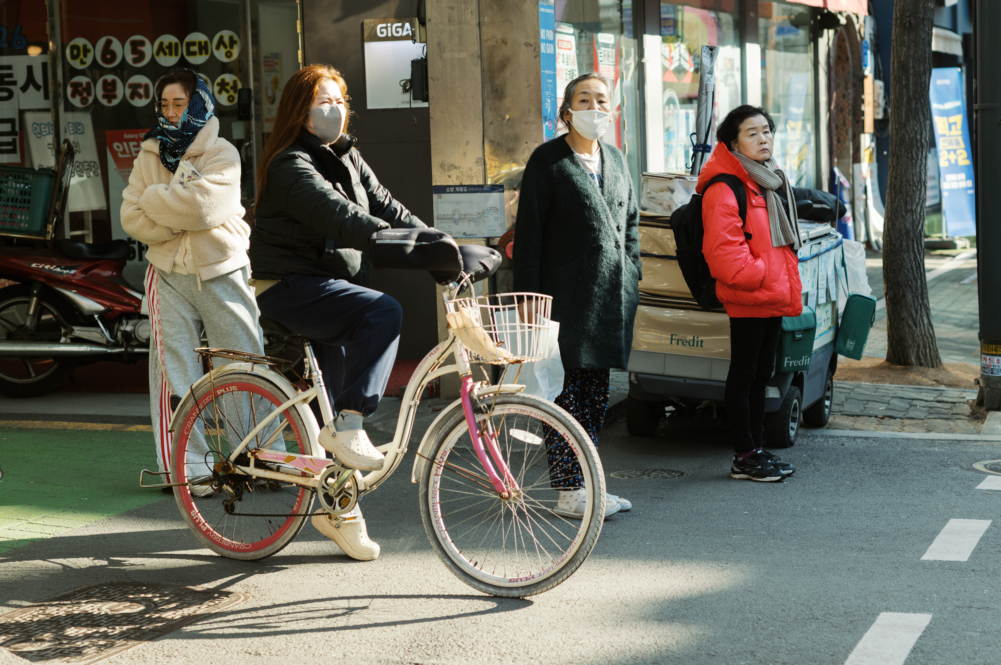 Women waiting at street corner