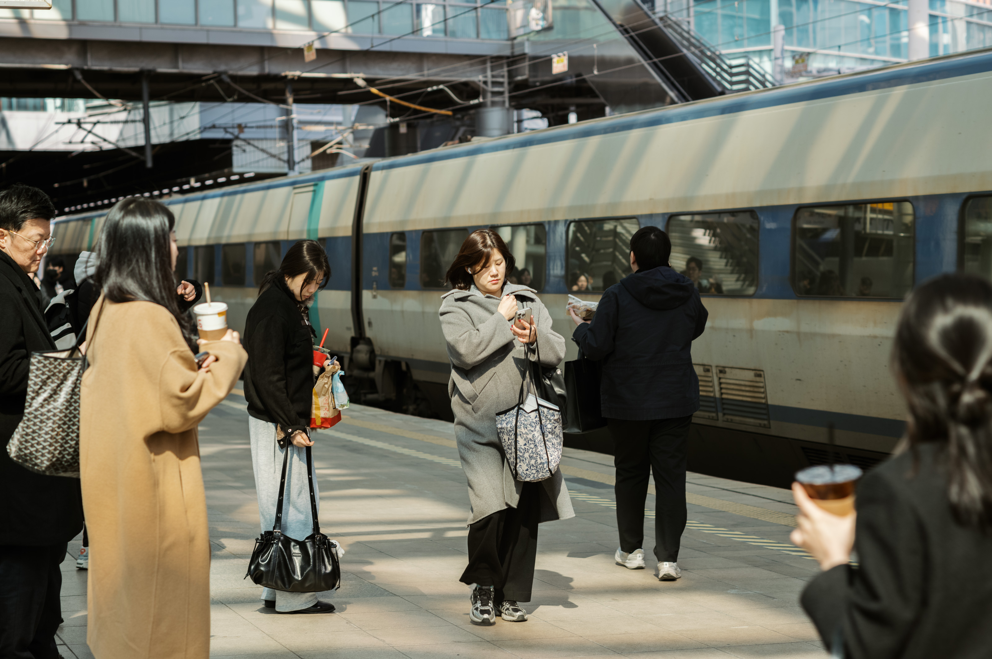 Korean woman walking in train station