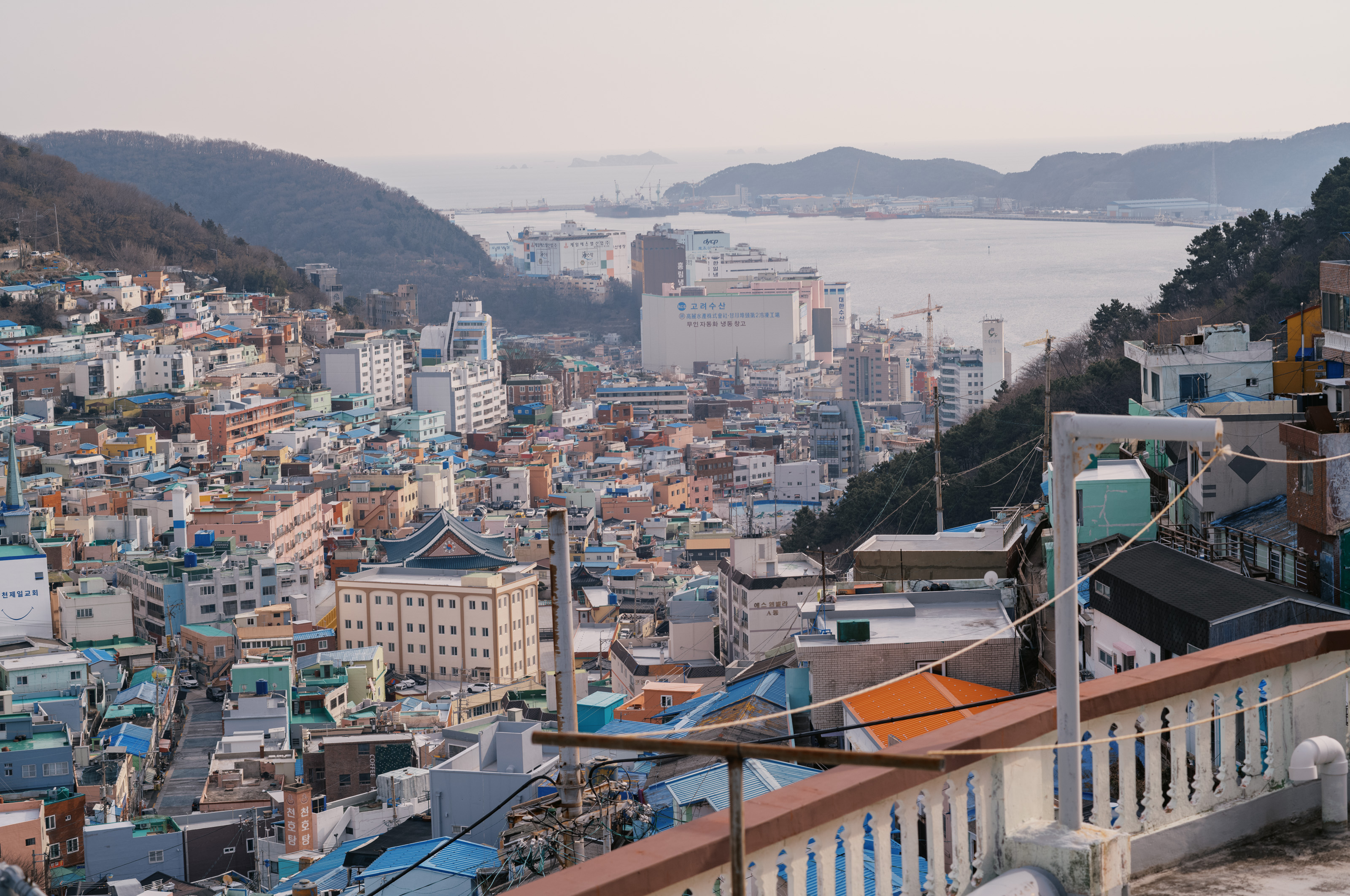 Men on bike looking at vendor stall