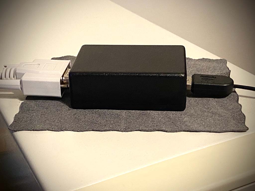 Picture of a black box with USB and serial connector