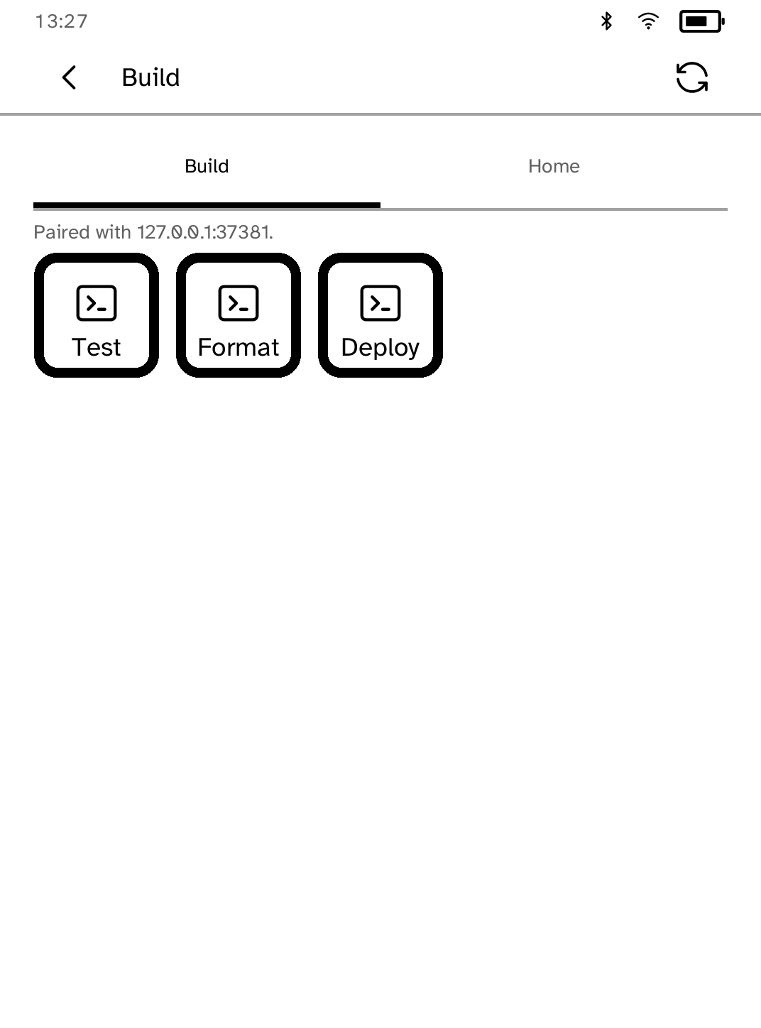 Deck paired with a computer, showing Test, Format and Deploy command pads.