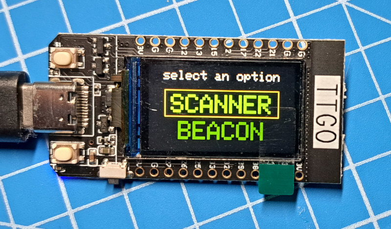 Image of a TTGO with the menu screen showing SCANNER band BEACON options.