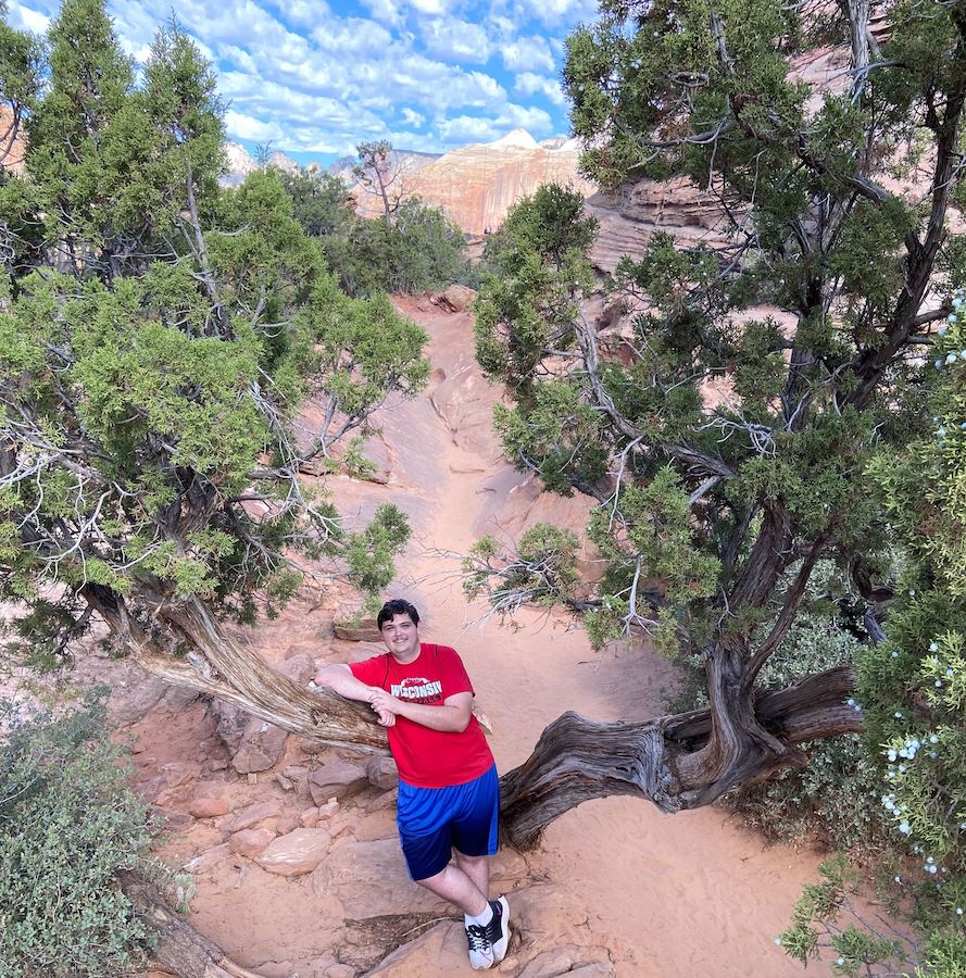 Cole posing with some trees.