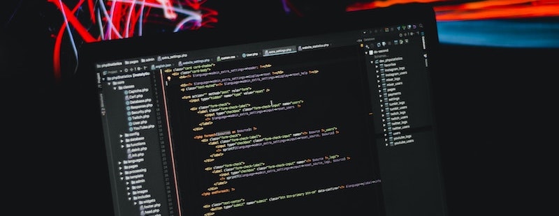 Computer screen with lines of code. Uploaded by AltumCode on Unsplash.