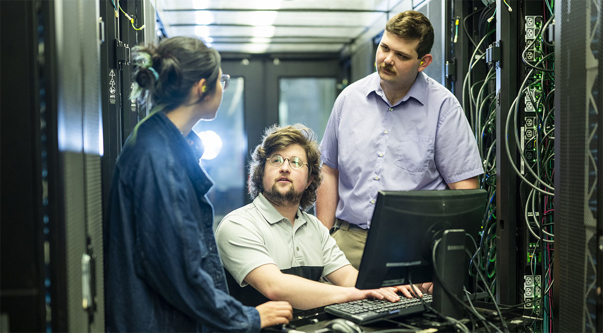 Researchers in a server room