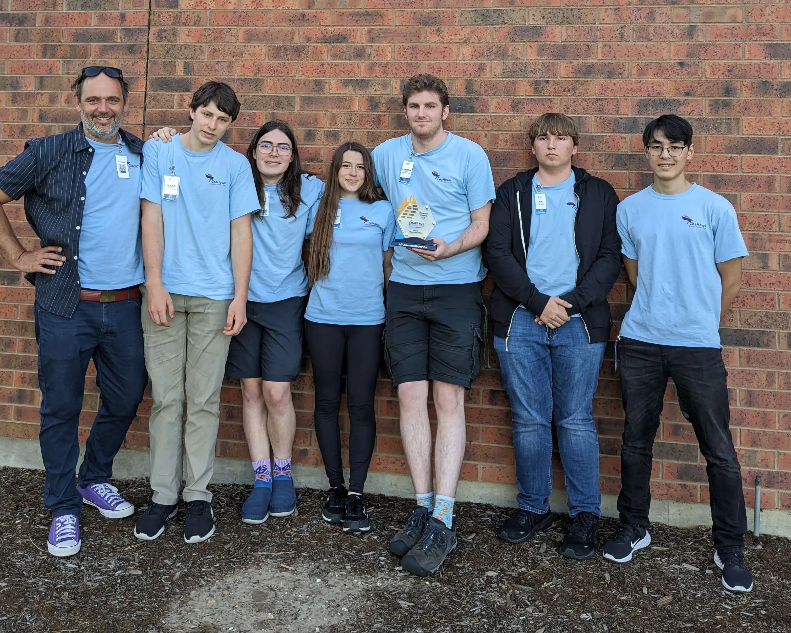 Cabrillo Robotics post first place win with trophy