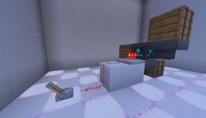 A Salvage Table driven by a repeater, with input and output chests around it