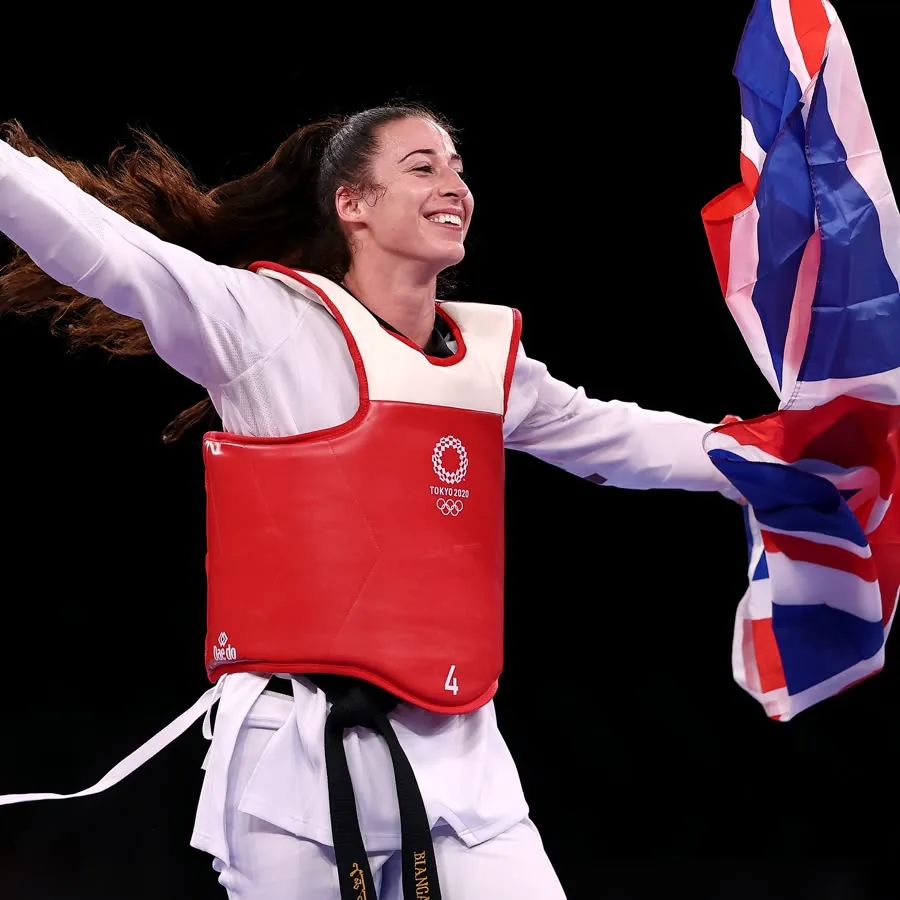 Bianca Cook celebrating with the Union Jack after winning Olympic bronze in Tokyo