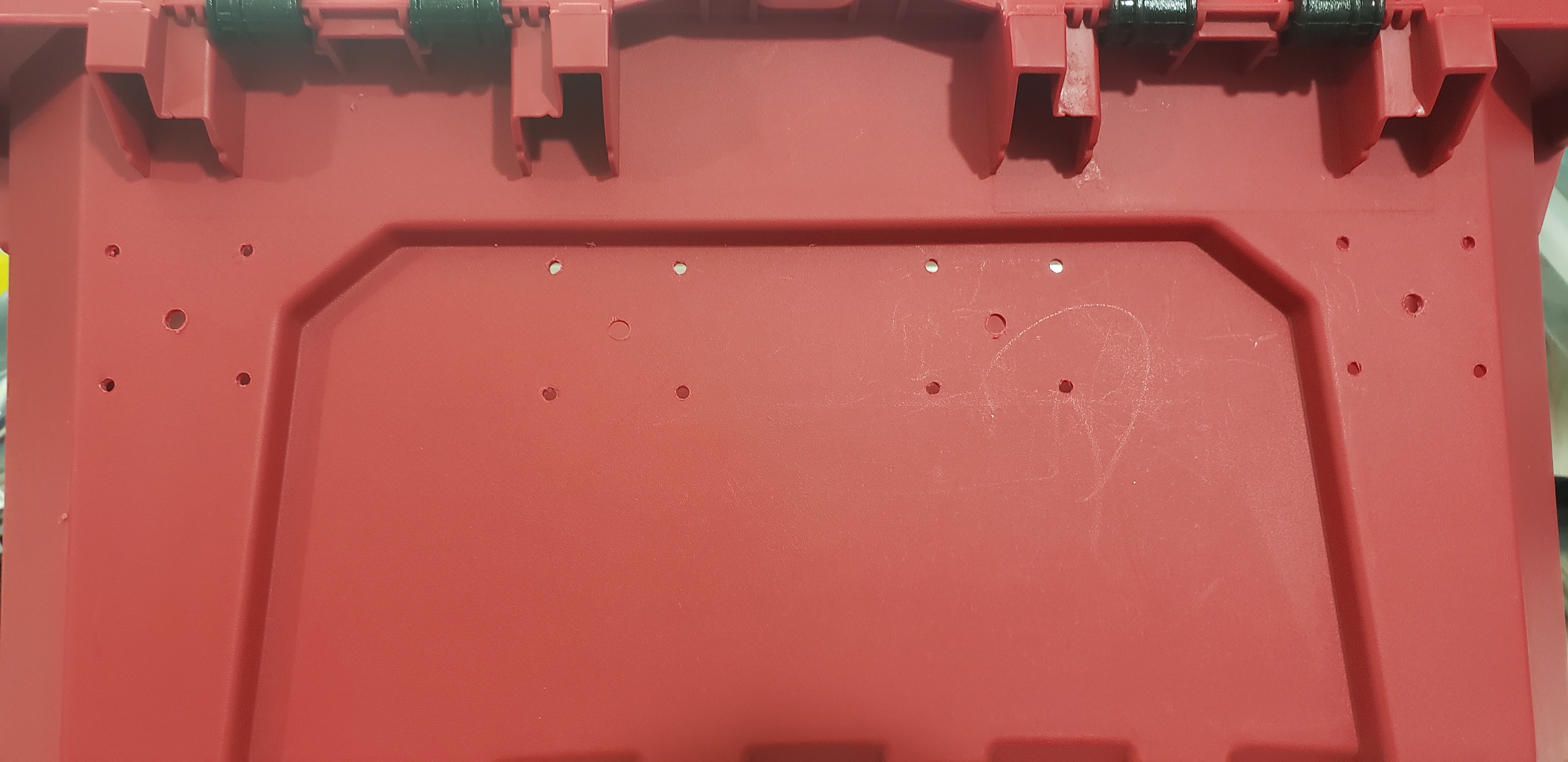 Filament port holes drilled into side of container.