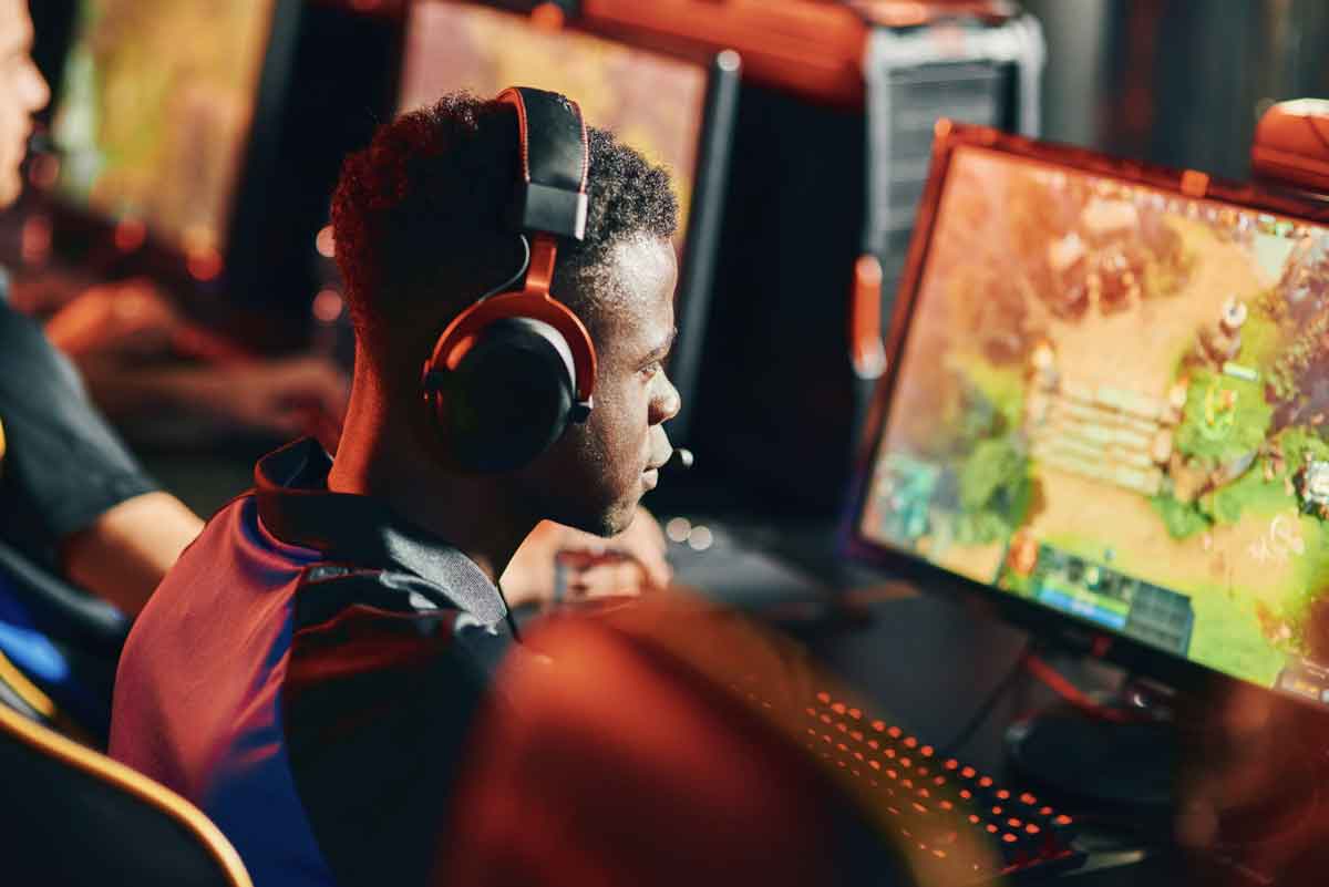 Esports gamer focused at a competitive gaming station