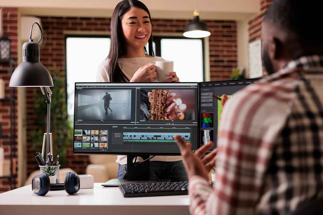 Agency professionals collaborating on video editing