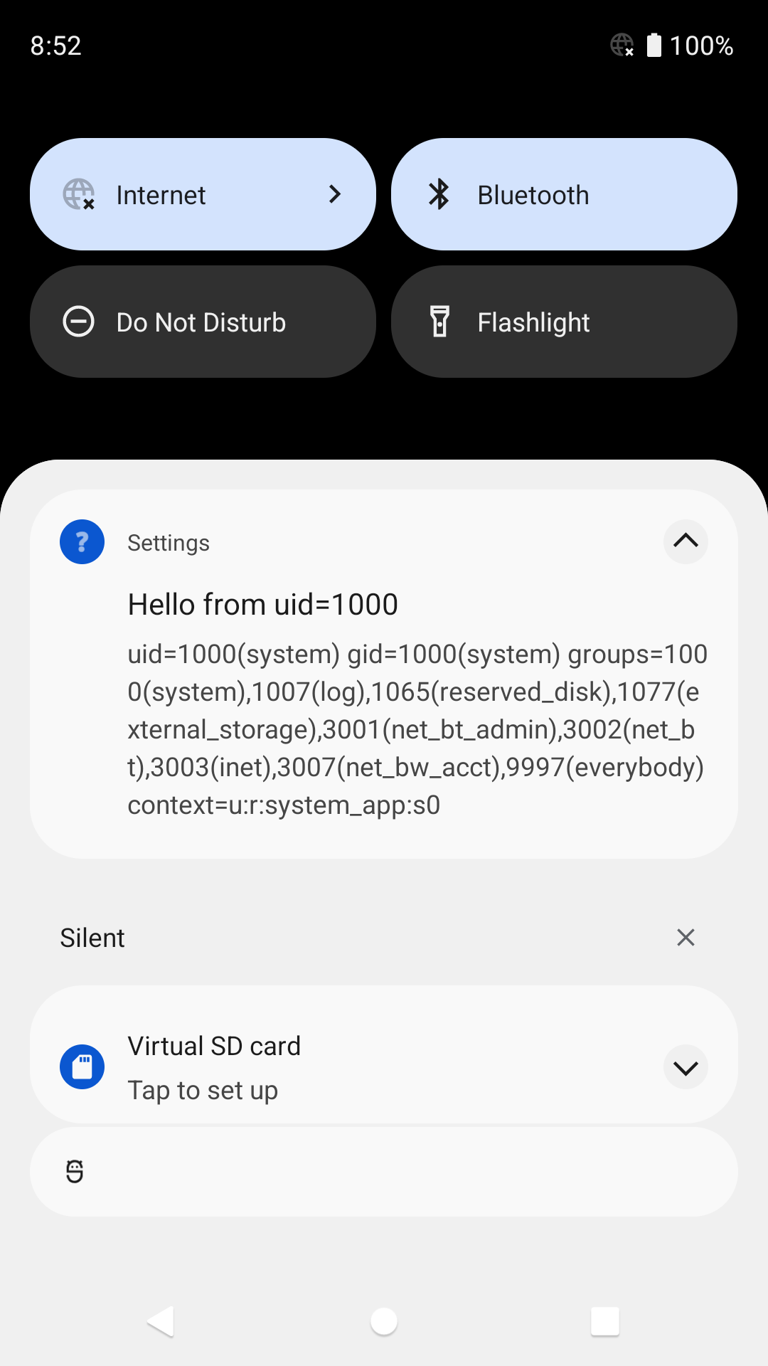 Screenshot of Android notification from Settings app: Hello from uid=1000(system) gid=1000(system) groups=1000(system),1007(log),1065(reserved_disk),1077(external_storage),3001(net_bt_admin),3002(net_bt),3003(inet),3007(net_bw_acct),9997(everybody) context=u:r:system_app:s0