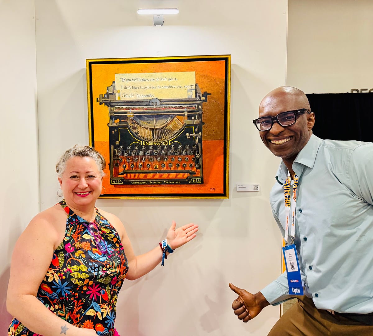 Amy Digi with her piece 'Typed Revolution' at Bitcoin 2026