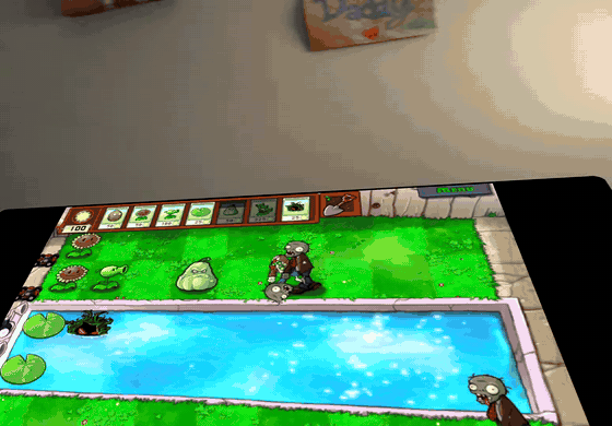Plants vs. Zombies on a DroidDeck panel in Quest passthrough, played with hand tracking