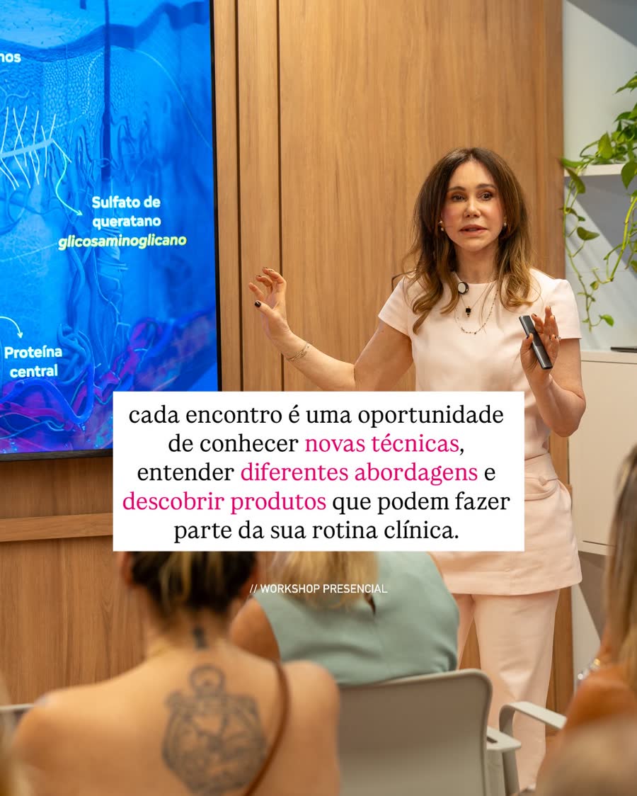 Professora explicando diagrama científico de pele no telão