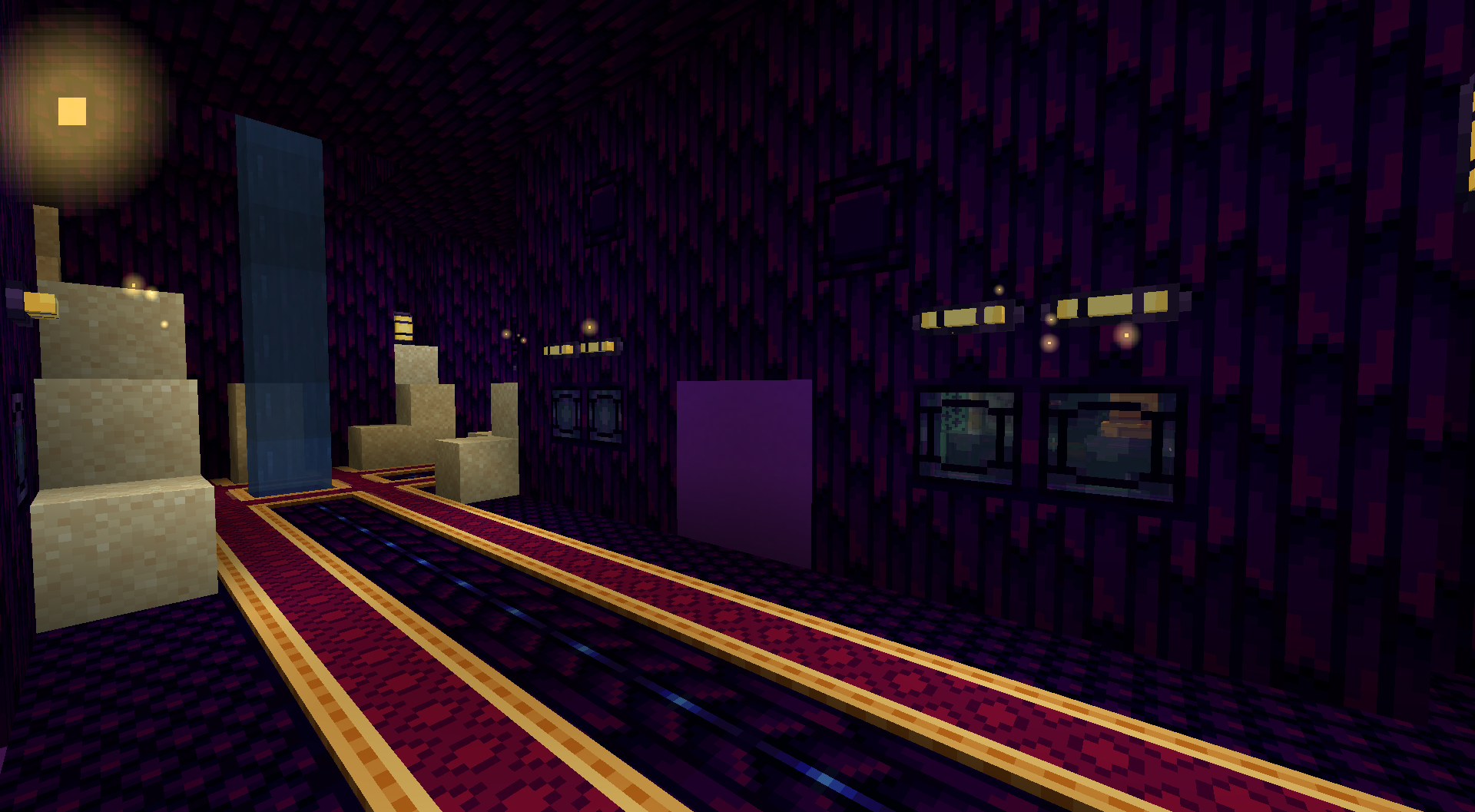 A hallway with a 2*2 door sealed shut using purple concrete, full of blown-in sand