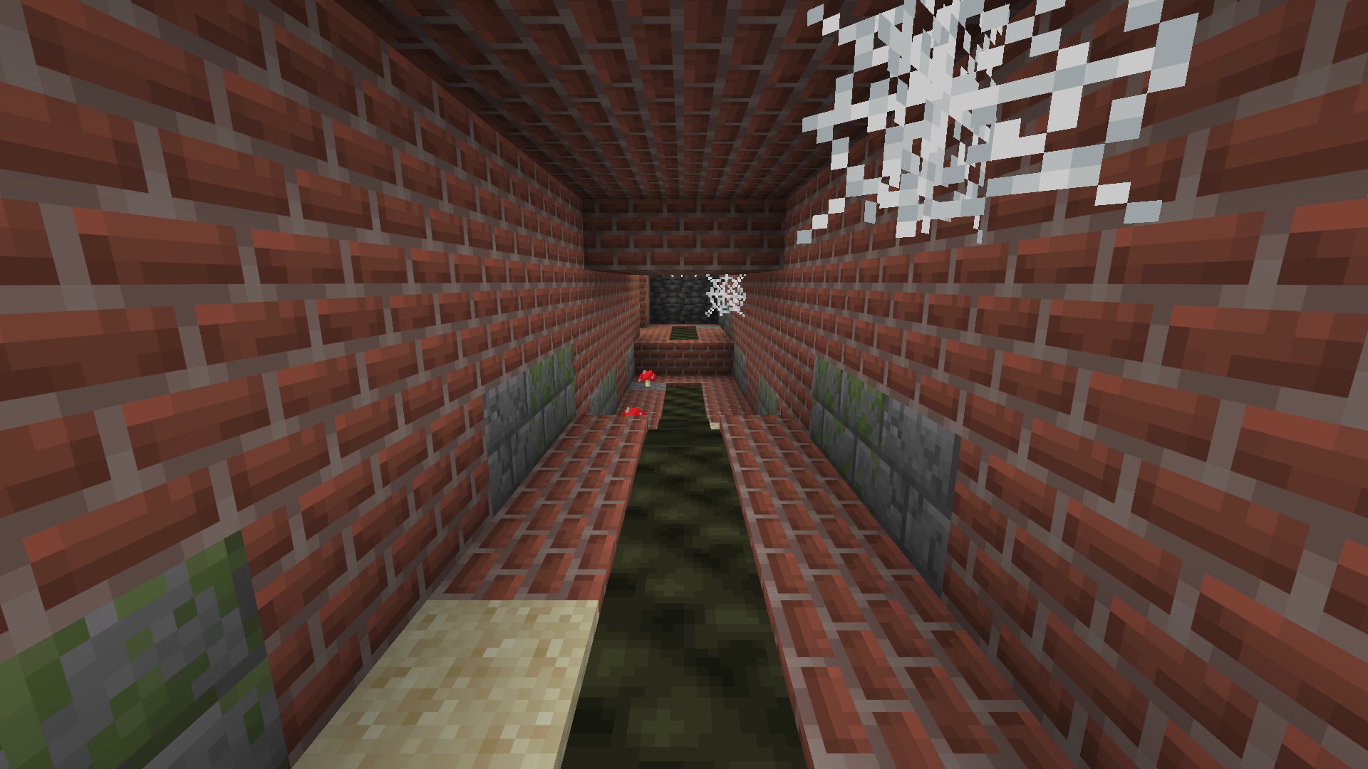 A sewer run. Leachate down the middle, dry brick either side, silt in the corners.