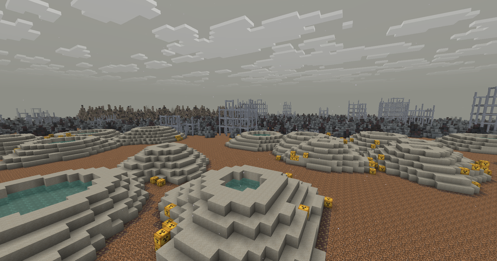 Tailings impoundments with decant ponds, drums at the toe.