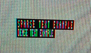 Zoomed in photo of a computer screen with individual pixels visible; RGB subpixels create the text "sparse text example" and "dense text example" where in the second one they're closer together