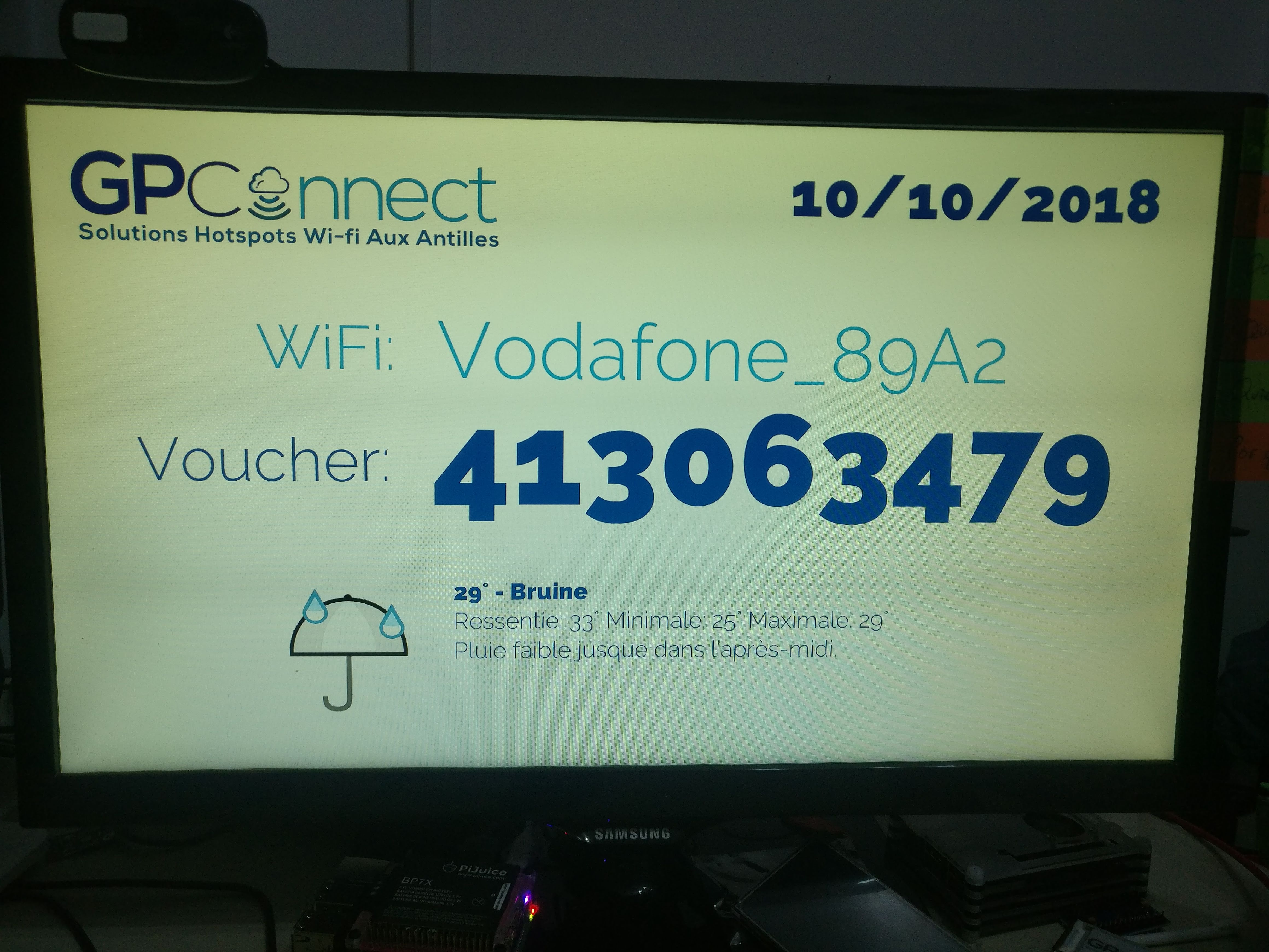 HDMI display showing voucher with rain weather