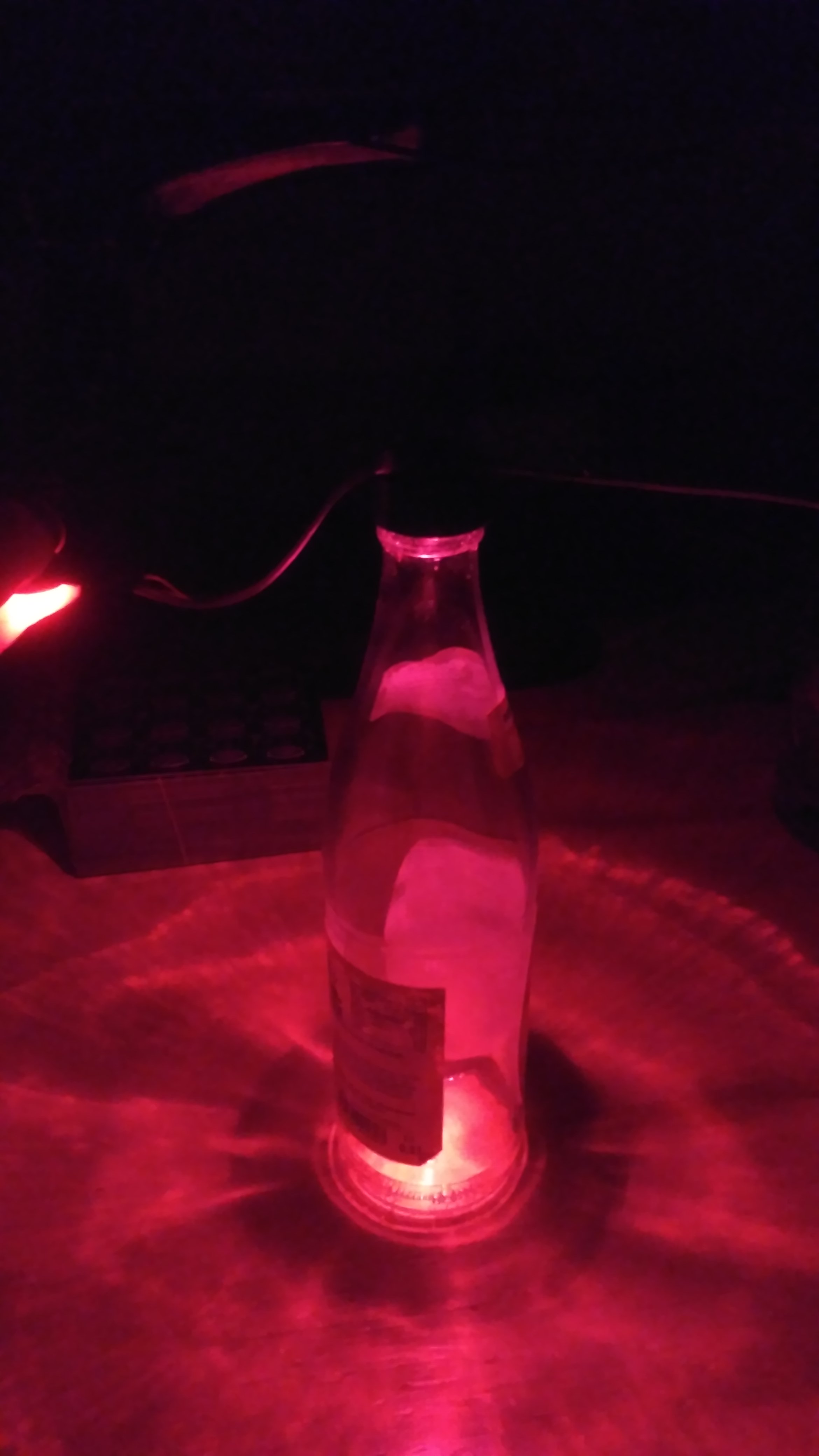 Assembled Mate bottle with PCB and screw cap lighting red