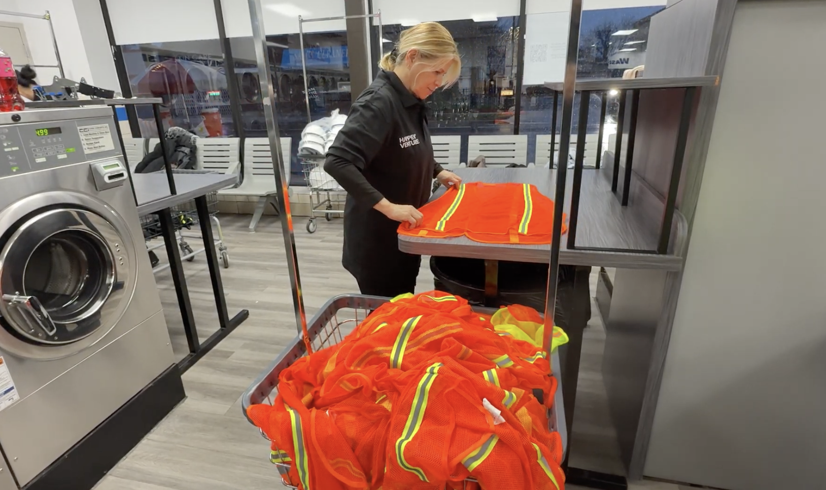 Laundered PPE vests folded and ready at an R3 rewash site