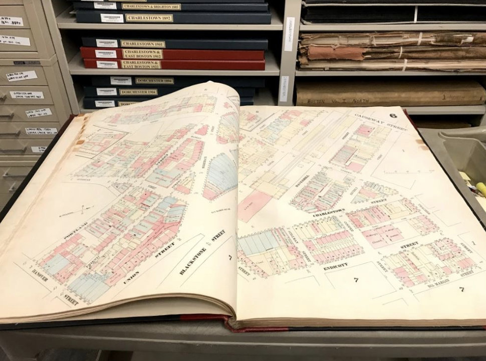 Picture of a real estate atlas open, it is a large book