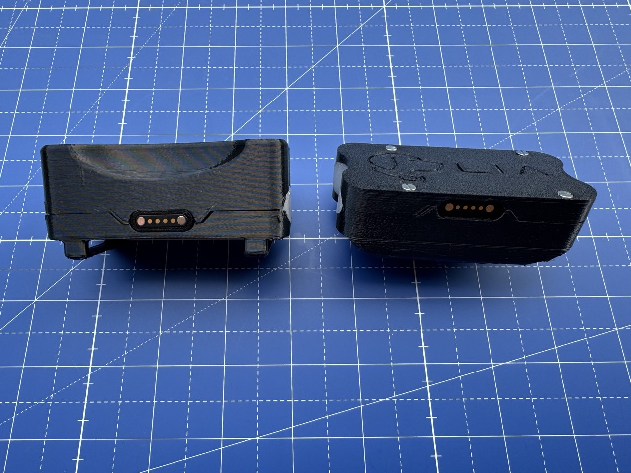 Enclosure LIA สองแบบแสดง Magnetic Pogo Charging Contacts