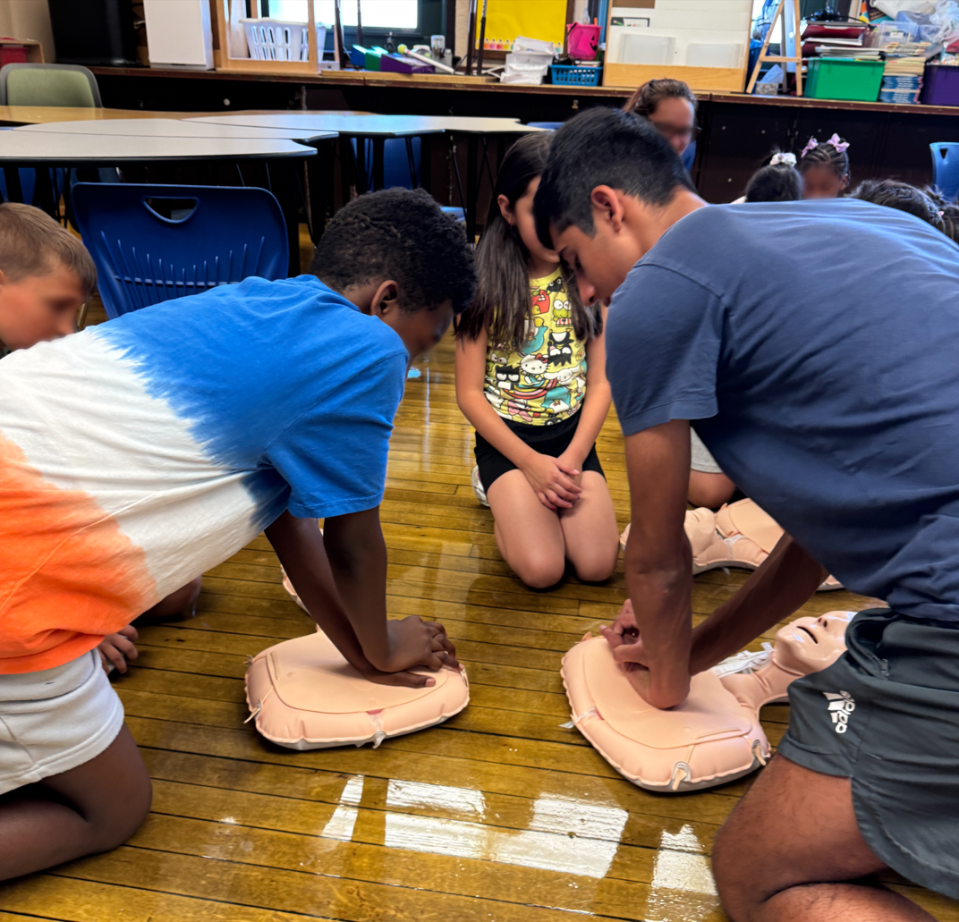 Jay Manadan performing CPR training