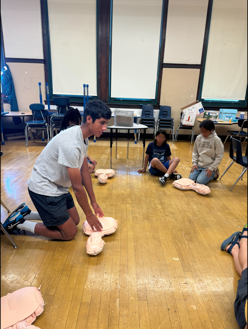 Jay Manadan teaching a hands-only CPR training session