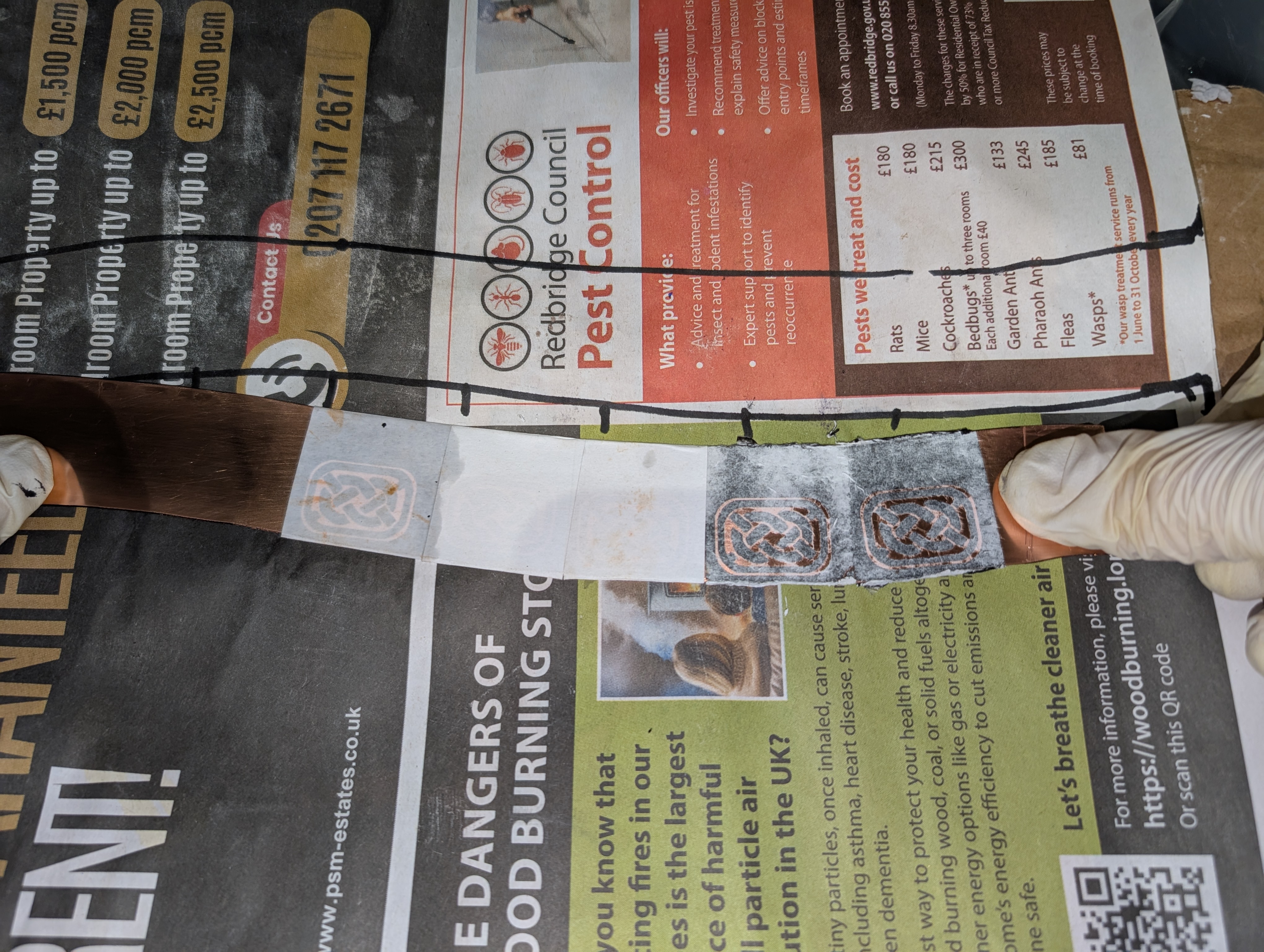 Three toner transfer attempts on copper showing partial, smeared and inconsistent results — typical of the failed methods