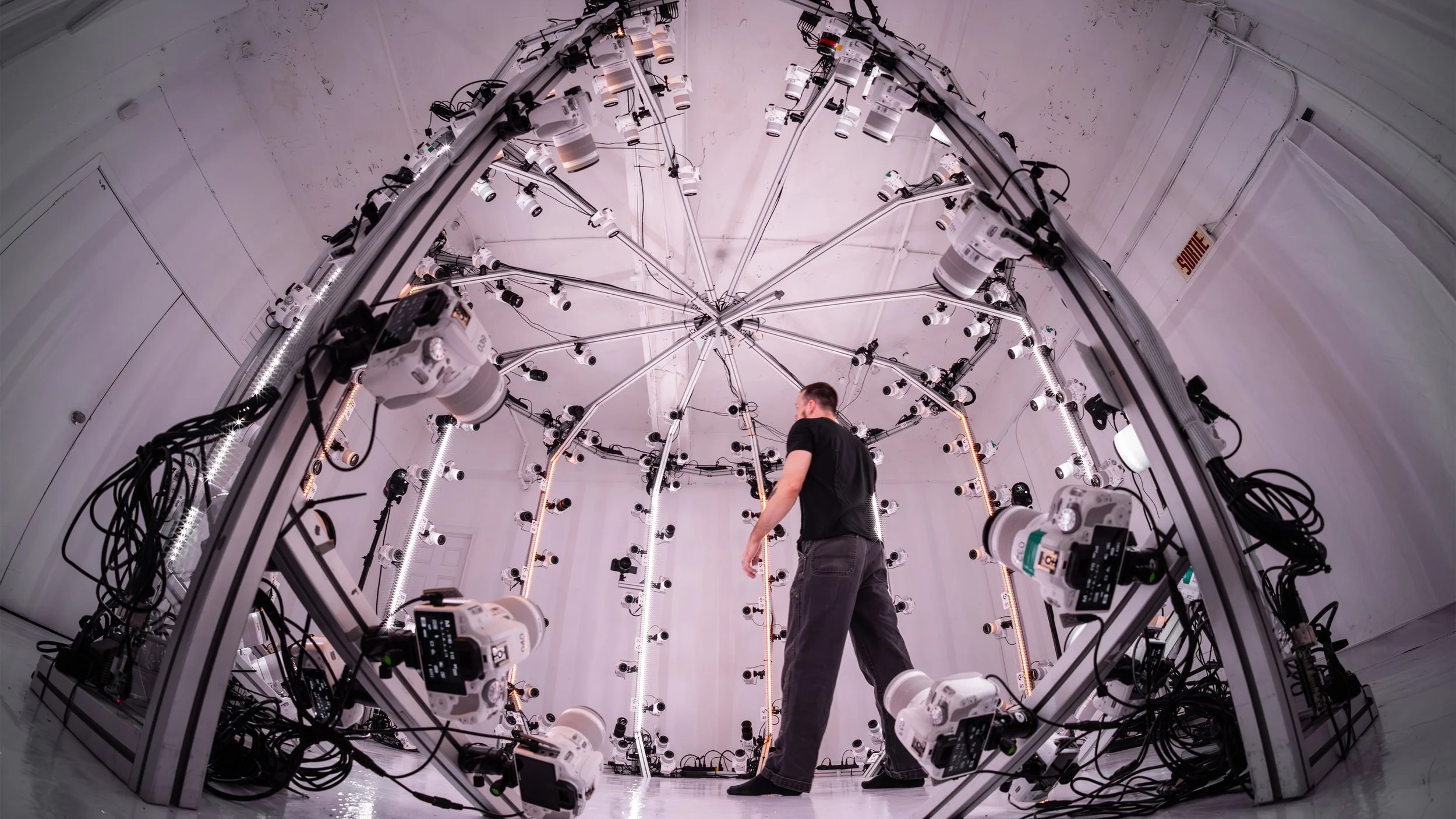 Camera dome with dozens of cameras surrounding a subject from all angles