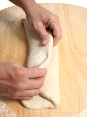 Flattening the dough into a rectangle