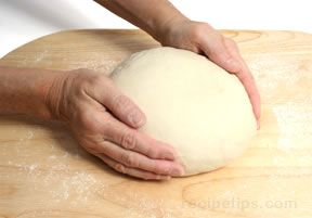Cupping the dough between your hands