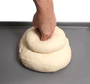 Pushing the finger-hole through both rounds