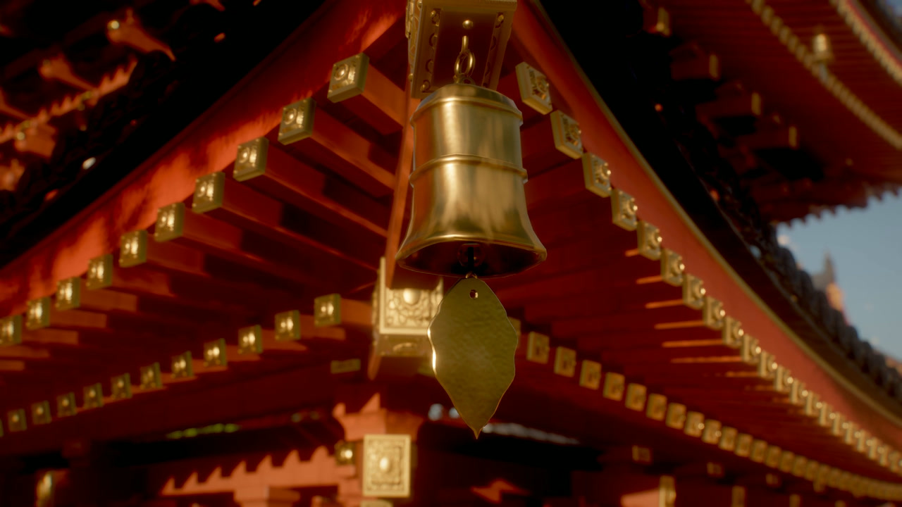 Bronze wind bell hanging under the vermilion rafters of the pagoda