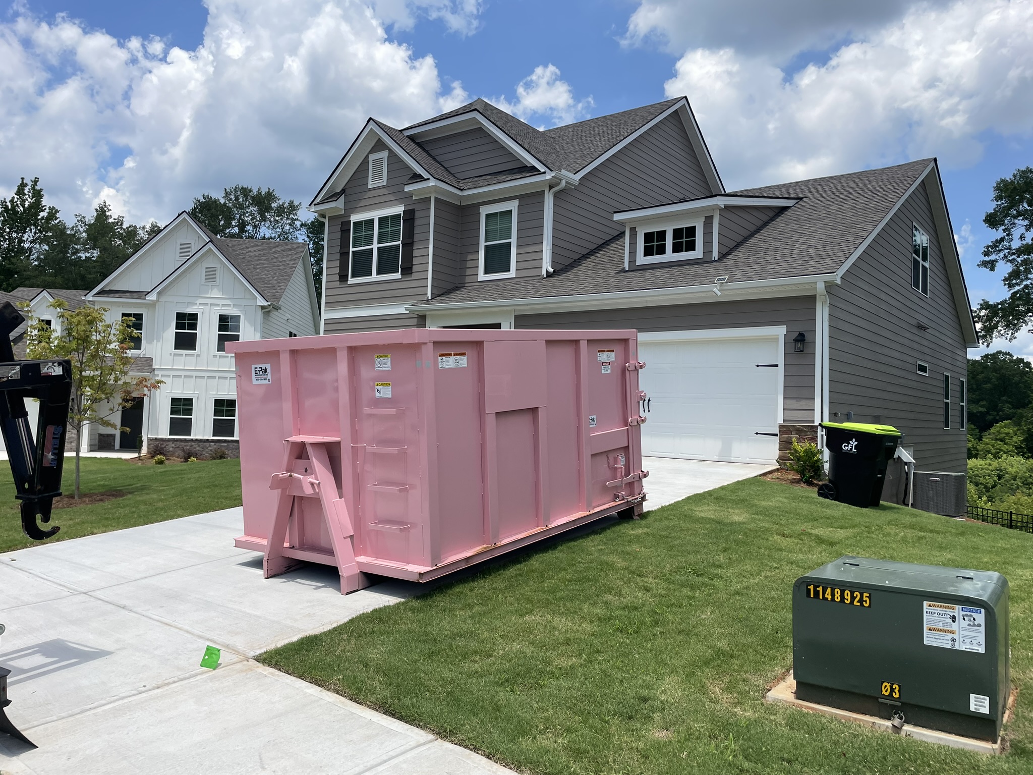 21 Yard Dumpster Rental Fayetteville GA - The Big Junker in residential driveway