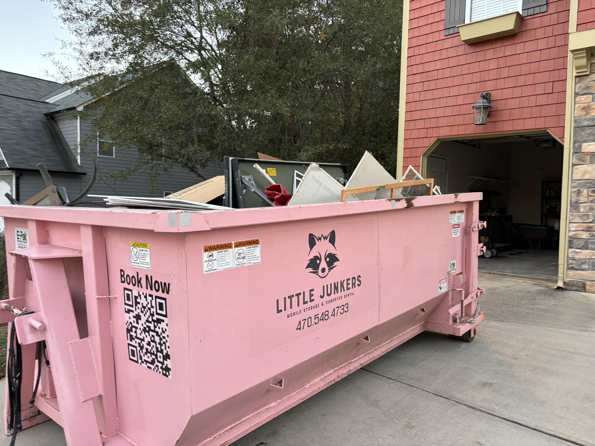 11 Yard Dumpster Rental South Atlanta - The Little Junker loaded beside garage