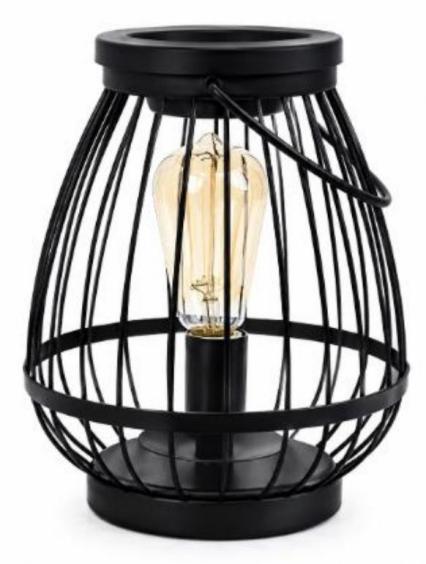 Black metal cage style wax warmer with warm light for home fragrance use