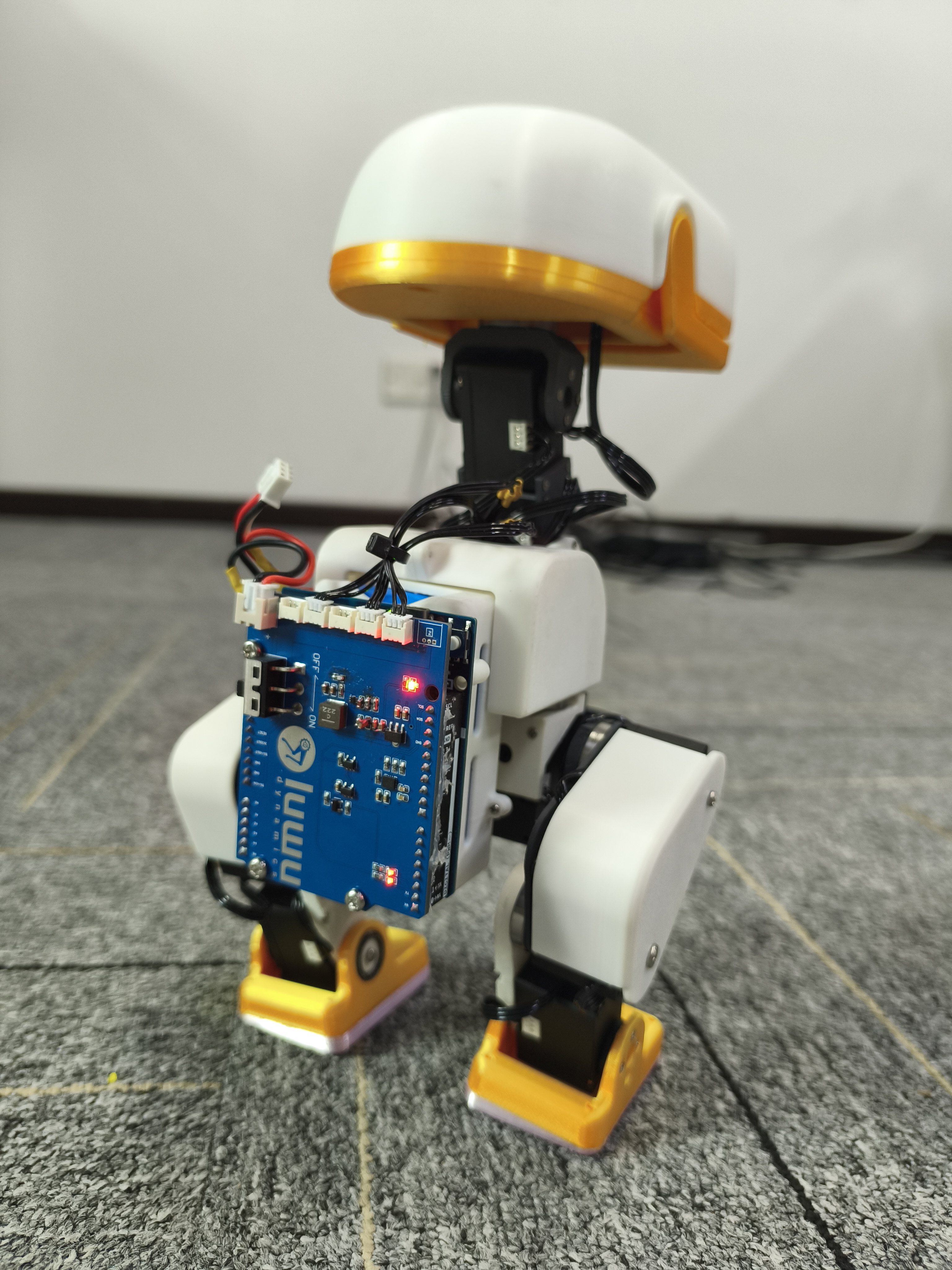 Rear prototype view showing the blue expansion board and servo wiring
