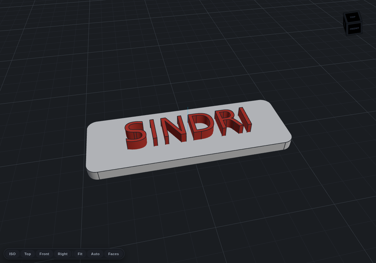 A white nameplate with red extruded sketch text reading SINDRI