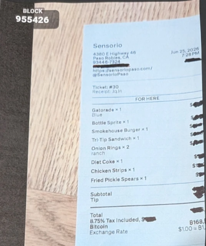 Restaurant receipt showing payment with Bitcoin via Lightning Network